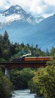 A train traveling over a bridge over a river photo