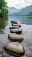 Stepping stones create a path across the tranquil lake surface photo