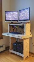 A computer desk with two monitors on top of it photo