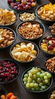 A variety of snacks and chips in bowls photo