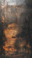 Textured wood panel shows a wave like pattern with dark borders photo