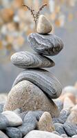 Stack of gray and beige stones in perfect balance photo