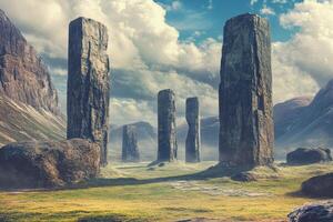 Standing stones monoliths dominate a mountainous landscape under a cloudy sky photo