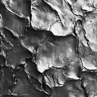 Textured surface with metallic sheen and irregular abstract patterns photo