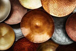 Various metallic circular platters layered creating an abstract background photo