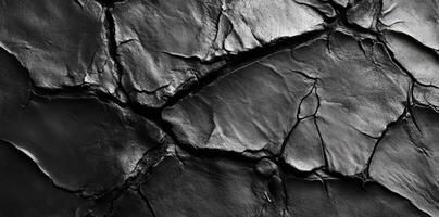 Cracked dark surface reveals texture in an abstract composition photo
