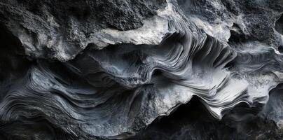 Gray stone shows layered textures shaped and eroded over time photo