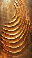 Textured golden brown artwork featuring concentric curved sculpted layers photo