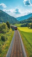 A train traveling through a green field photo