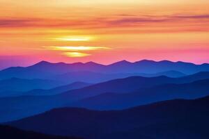 The sun sets over the mountains in the blue ridge parkway photo