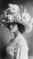 A woman wearing a large hat with flowers photo