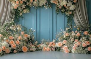 A wedding backdrop with flowers and a blue door photo