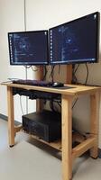 A computer desk with two monitors on it photo