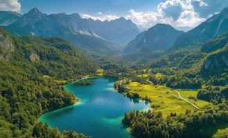 Scenic mountain landscape with a tranquil lake surrounded by lush greenery and towering peaks photo