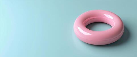 Floating pink ring on a soft blue surface creates a calm and playful atmosphere photo