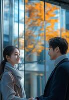 A couple standing in front of a building photo