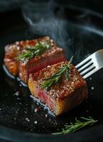 Juicy grilled steak served with fresh herbs on a black plate in a cozy setting photo