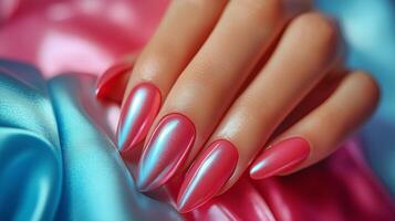 A woman's hand with red and pink nails photo