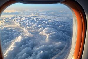 An airplane window view of clouds and sky photo