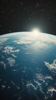 The earth is seen from space with the sun shining photo