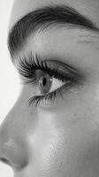 A close up of a woman's eye with long eyelashes photo