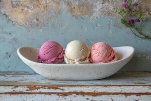 Three scoops of ice cream in a bowl photo