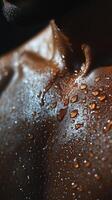 A man's chest covered in water droplets photo