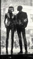 A man and woman standing in front of a window photo