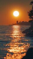 A person on a surfboard riding the waves at sunset photo