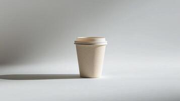Simple disposable cup on a light background with soft shadows photo