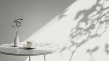 Morning light illuminates a simple setup with coffee and delicate shadows on a white table photo