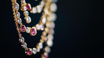 Exquisite gold chain with sparkling gemstones displayed against a dark backdrop photo