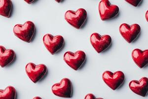Red heart shapes arranged creatively on a light background for decoration or celebration photo
