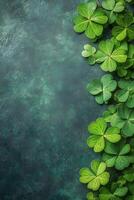 Celebration of greenery with clover leaves on a textured dark green background photo
