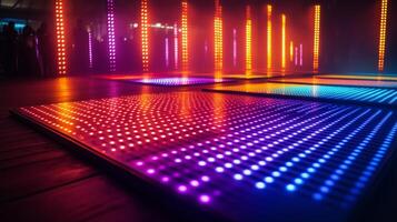 Colorful LED lights create vibrant atmosphere at a music event in a modern venue photo