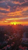 The sun sets over the city skyline in this photo