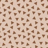 Seamless geometric pattern with brown triangles on beige background vector