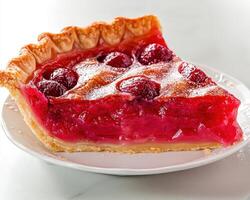 A slice of homemade raspberry pie on a white plate photo