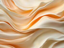 Abstract flowing fabric background with soft peach and cream colors photo