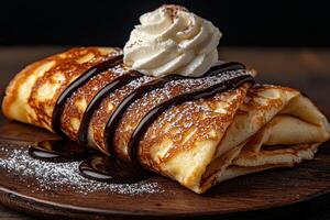 a large delicious crepe with chocolate sauce and whipped cream. photo