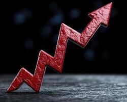 Red arrow pointing upwards, representing growth and success photo