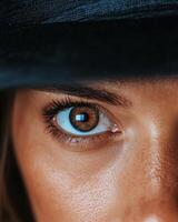 Close up of a brown eye with long eyelashes photo