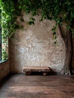 Rustic stone bench in a room with a tree and vines photo