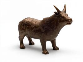 Bronze bull statue with circuit board pattern on white background photo