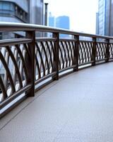 Modern architecture featuring a curved walkway with metal railings in an urban setting photo