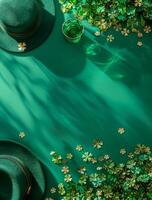 A green background with two green hats and a glass of green liquid. The hats are placed on the left side of the image and the glass is on the right side. The background is filled with green flowers photo