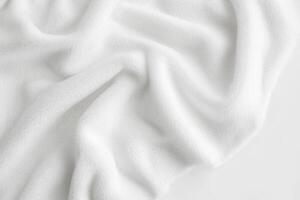 Soft, white fabric draped elegantly. Luxurious texture and subtle folds. photo