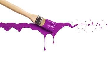 Paintbrush and purple paint splatter top view isolated on white background Dynamic top-view image of a paintbrush with bold purple paint splatters on a white background photo