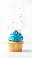 Cupcakes falling down isolated on white background Crisp image of colorful cupcakes tumbling mid-air against a clean white background perfect for bakery ads dessert blogs or playful food presentations photo