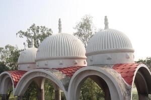 A white dome with red tiled roof photo